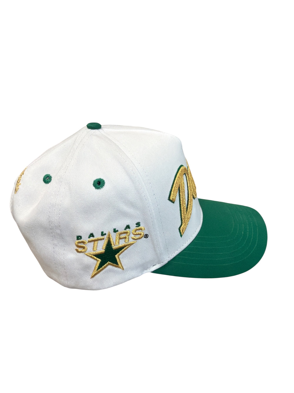 White cap with green bill and Dallas Stars retro logo on a white background