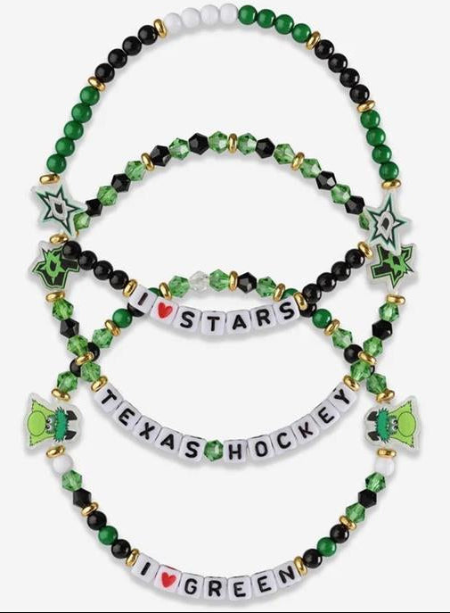 A set of four beaded stretch bracelets themed around Texas hockey, featuring green and black beads, white letter beads spelling out words, green star charms, and green hockey stick charms on a light gray background.