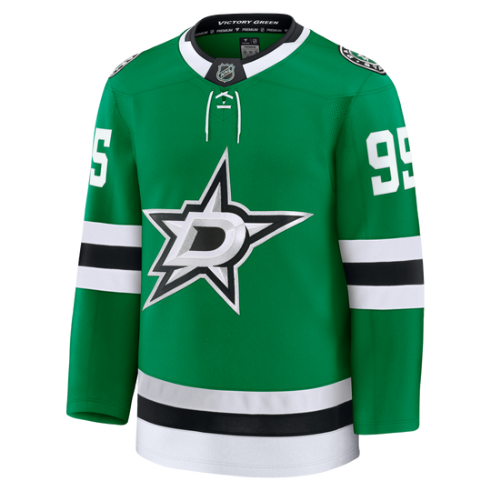 A green Dallas Stars hockey jersey with white and black accents, featuring the team&
