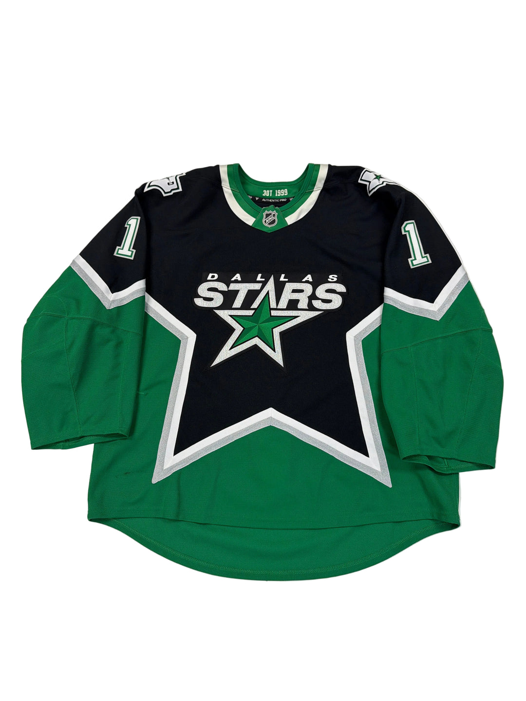 Green and black sports jersey with star logo on a white surface