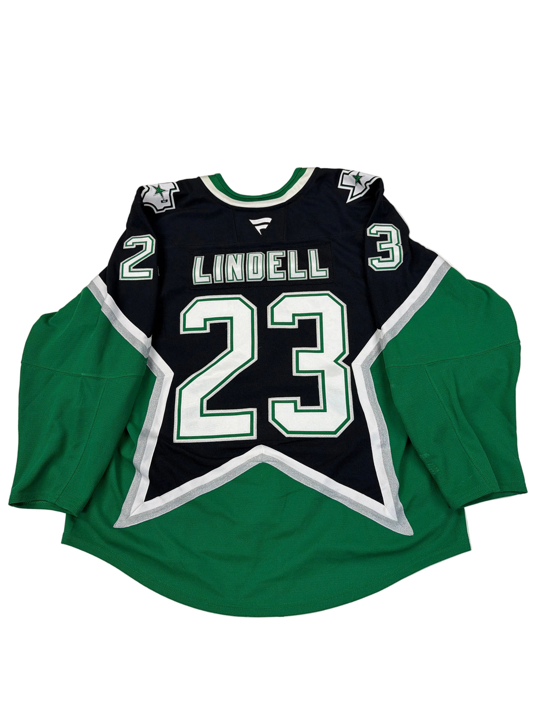 Green and black hoodie with number 23 and name 'Lindell' on a white surface.