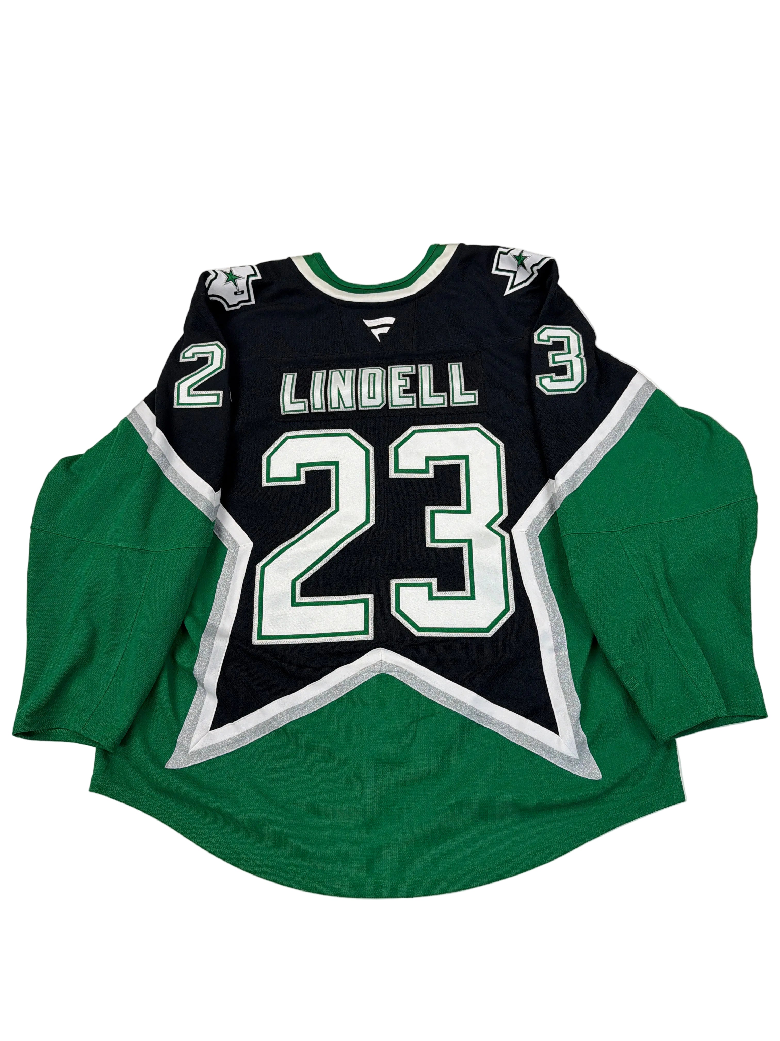 Green and black hoodie with number 23 and name 'Lindell' on a white surface.