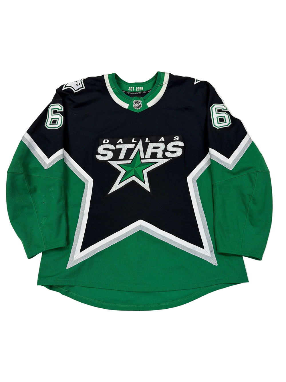 Green and black sports jersey with star logo on a white surface