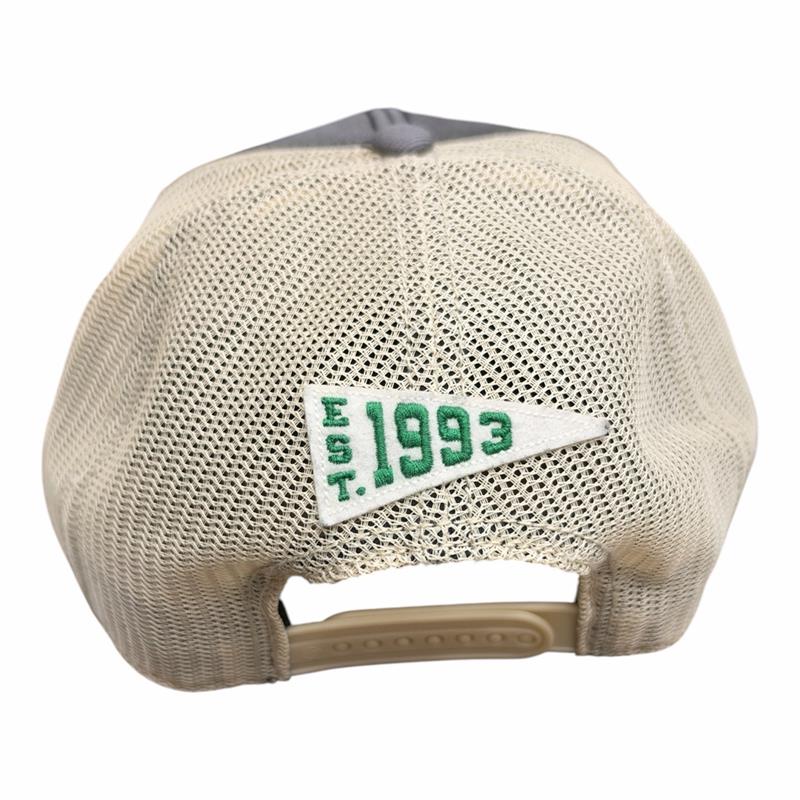 Dallas Stars vintage-inspired trucker cap featuring a cream mesh back and an embroidered “EST. 1993” pennant felt patch in green and white, with an adjustable snapback closure.