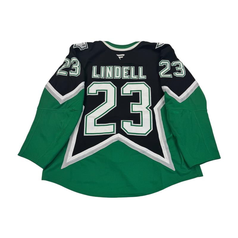 Green and black Dallas Stars '99 Alternate Jersey number 23 and name 'Lindell' on back. Jersey on a white background