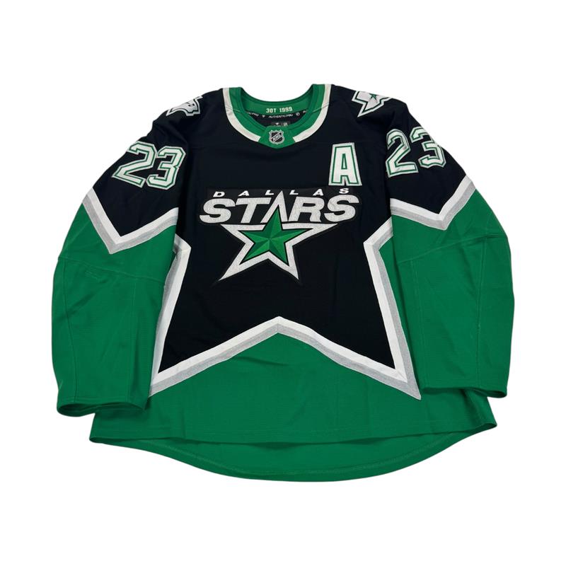 Dallas Stars hockey jersey with number 23 on sleeves. Jersey on a white background