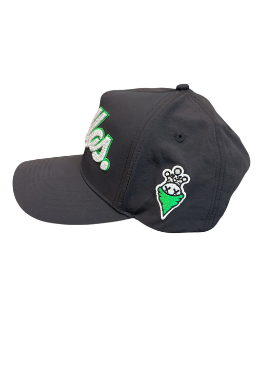 Black cap with green and white designs on a white background