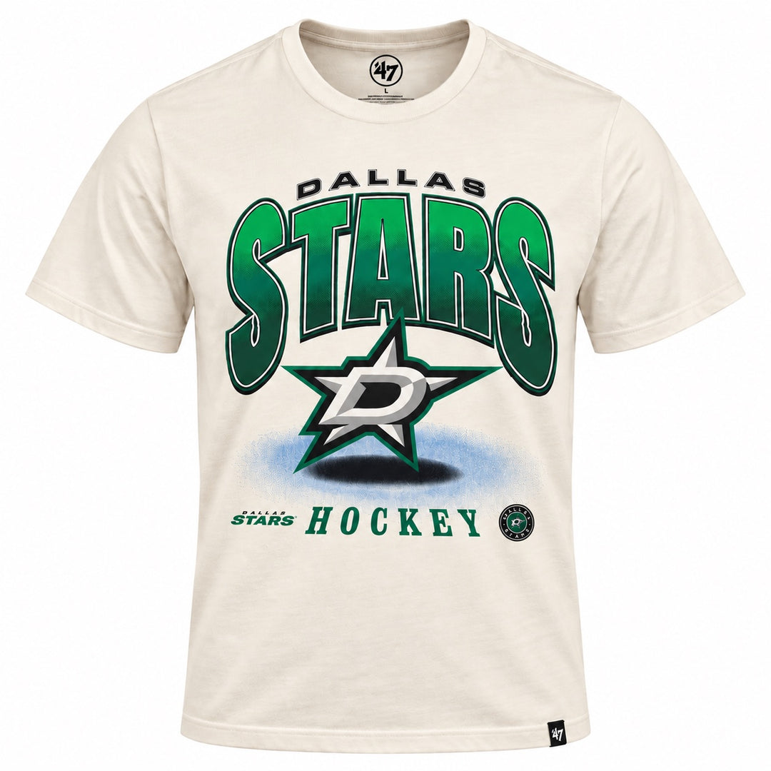 Cream-colored short-sleeve Dallas Stars T-shirt featuring large green-and-black “STARS” lettering with “DALLAS” above. A large Dallas Stars logo is centered over a blue shadow effect, with green “HOCKEY” lettering and smaller Dallas Stars graphics along the bottom. White background.