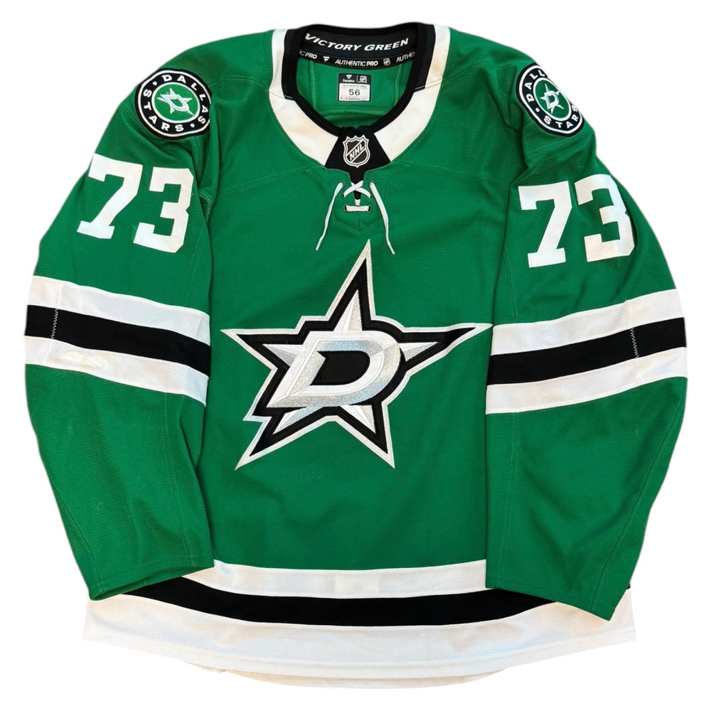 Green hockey jersey with number 73 and star logo on a white background