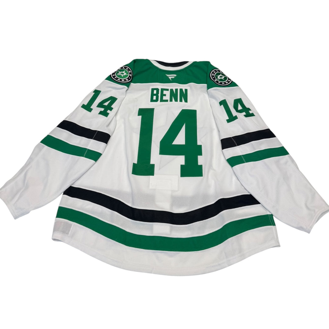 Game worn Dallas Stars away jersey with number 14 and name 'Benn'. Jersey on a white background