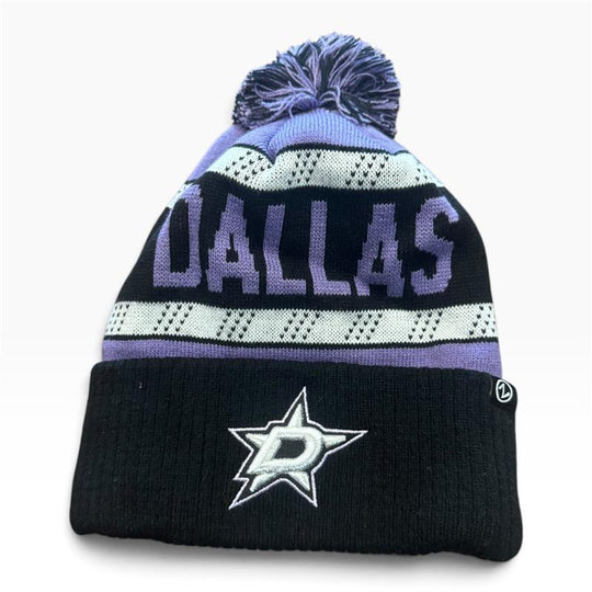A knit pom-pom beanie hat for the Dallas Stars, featuring a black cuff with the team&