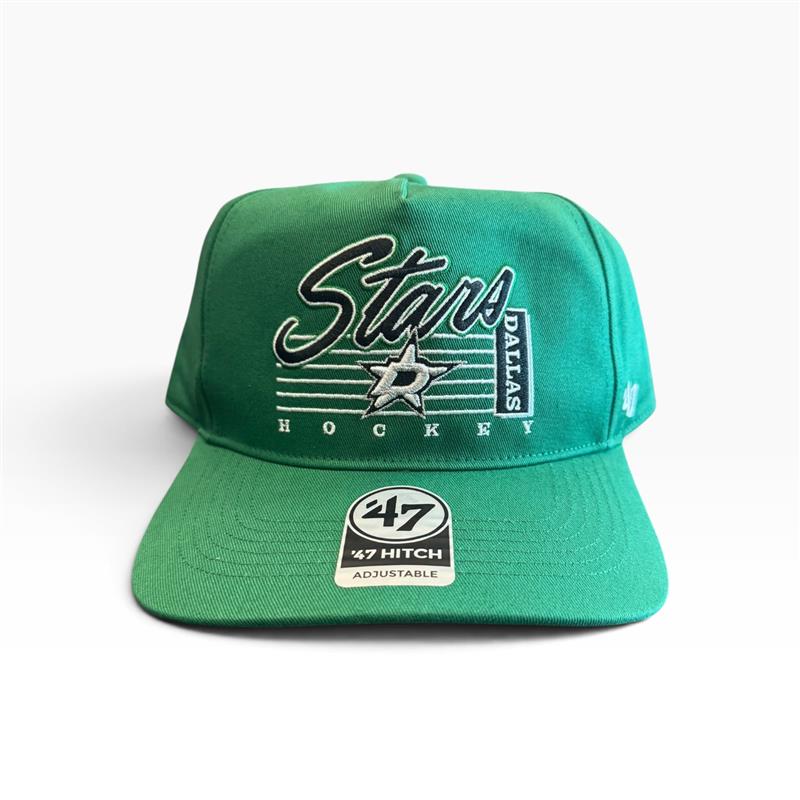 A green 47 brand Dallas Stars Hockey snapback cap on a light gray background. The front features a white and black embroidered Dallas Stars logo, and the brim has a white 47 Hitch sticker.