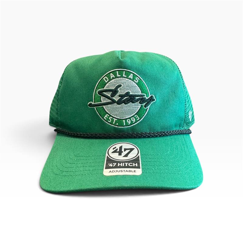 A green trucker-style cap with a circular embroidered &