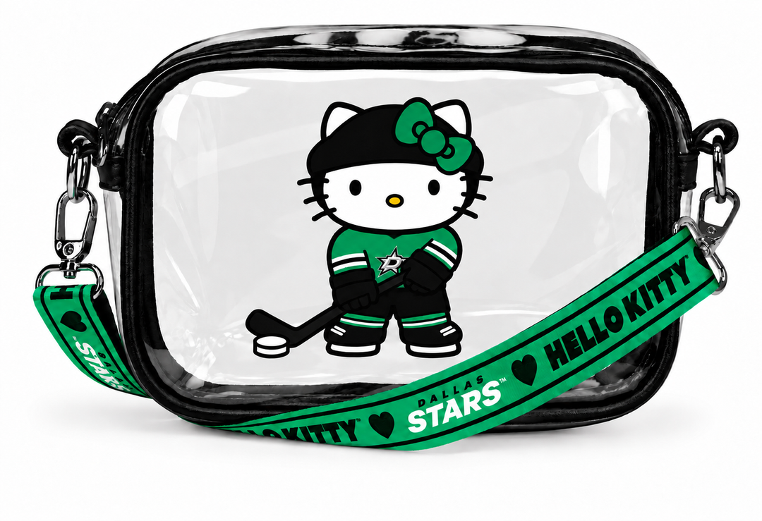 A clear plastic cosmetic pouch with a black zipper and trim, featuring a printed Hello Kitty as a hockey player on the front. A green adjustable shoulder strap with &