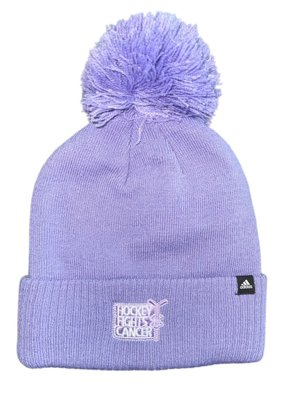 Purple beanie with pom-pom and Adidas logo on a white background