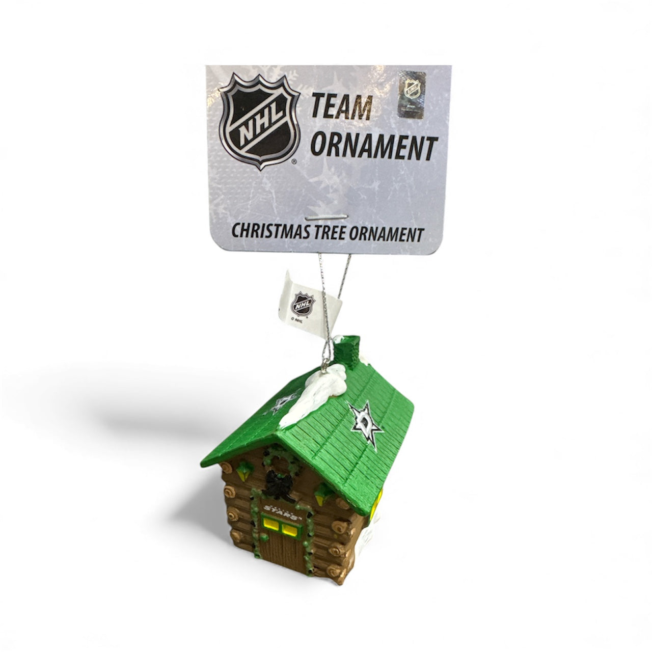 Christmas tree ornament Log Cabin with a green roof, featuring the NHL logo on a white background.