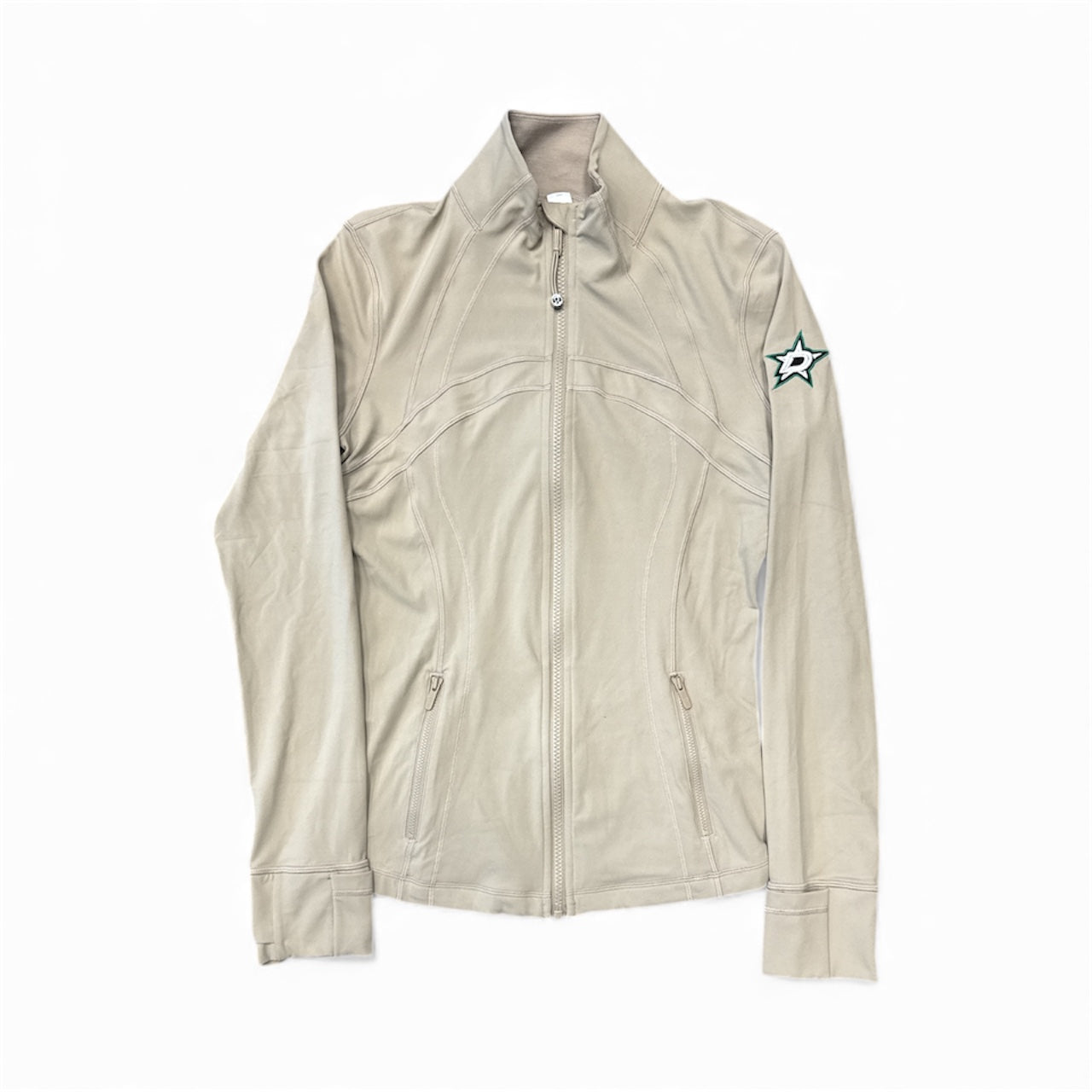 Beige jacket with a star patch on a white background