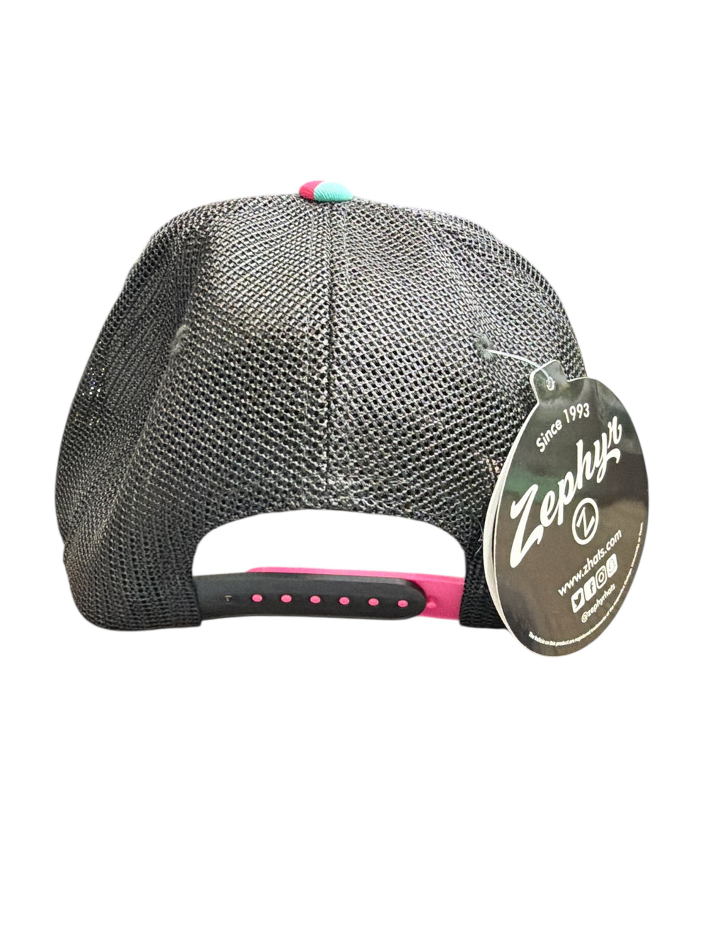 Black mesh cap with pink accents and Zephyr brand tag on a white background