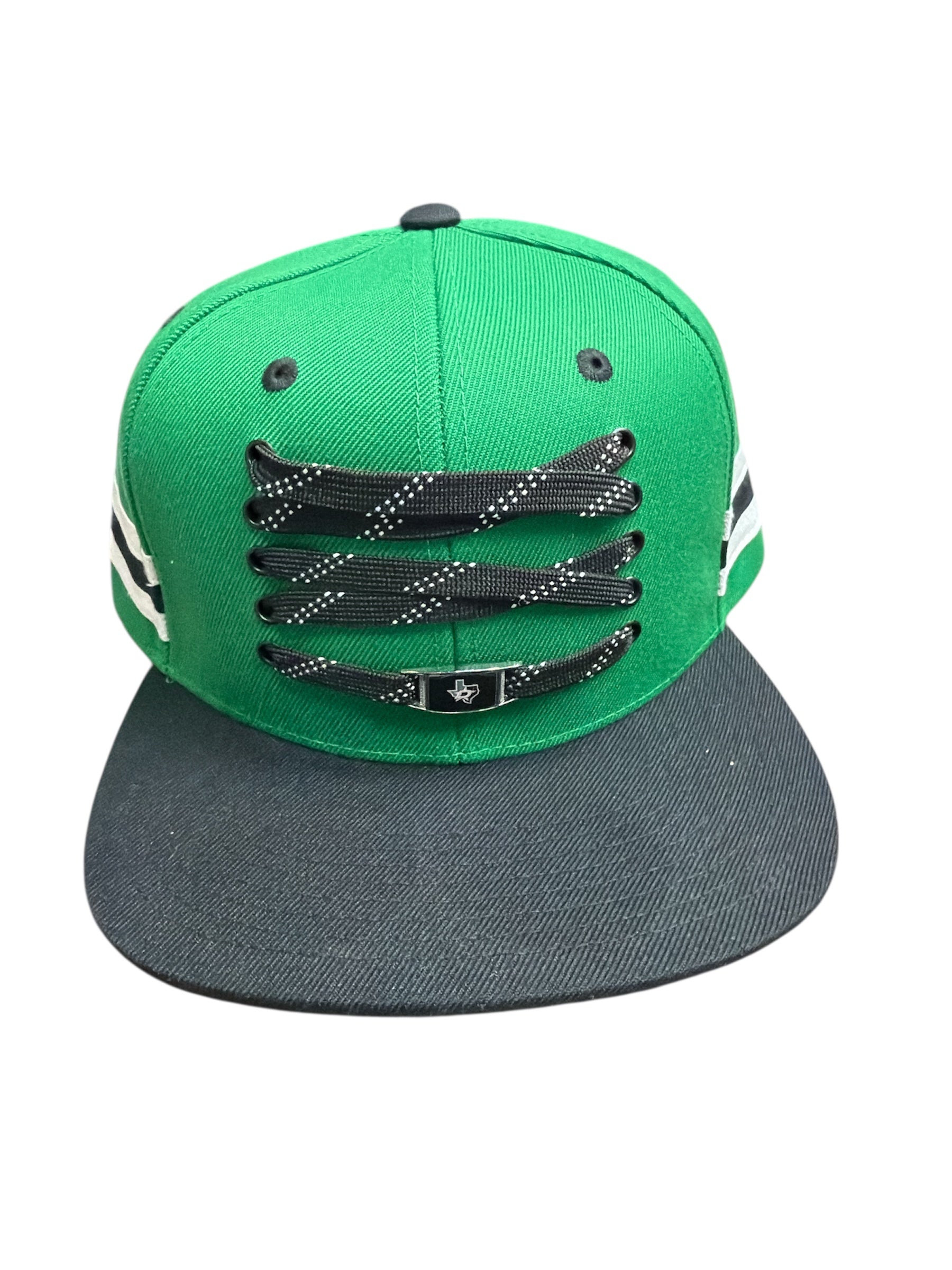 Green and black cap with black and white design on a white background