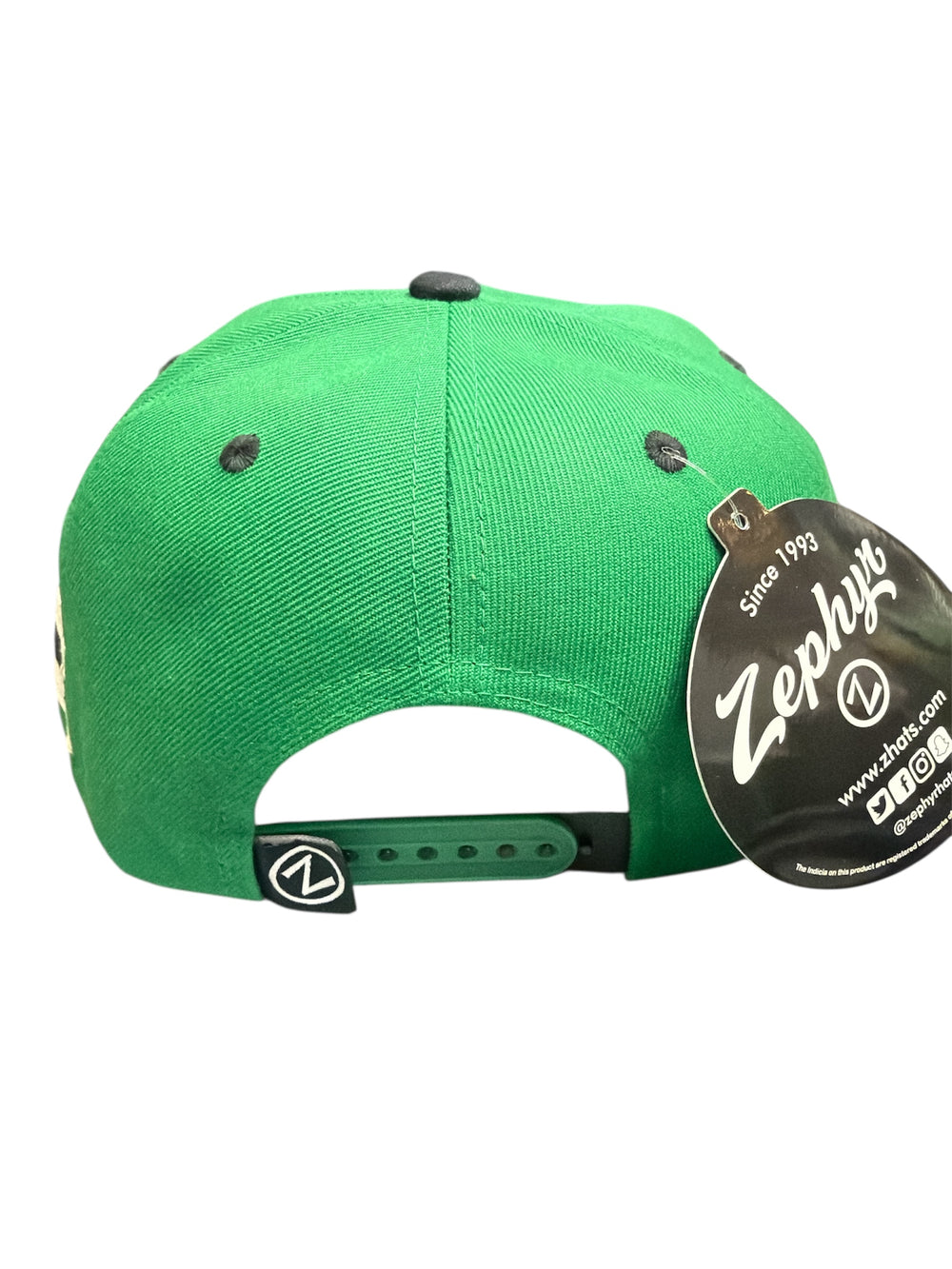 Green cap with a Zephyr brand tag on a white background