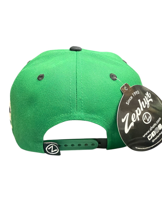 Green cap with a Zephyr brand tag on a white background