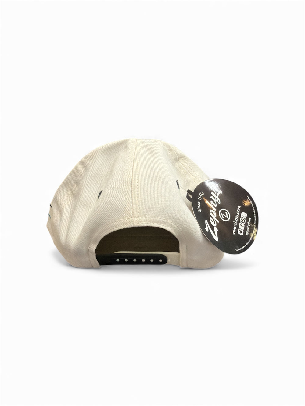 Beige cap with a brand tag on a white background
