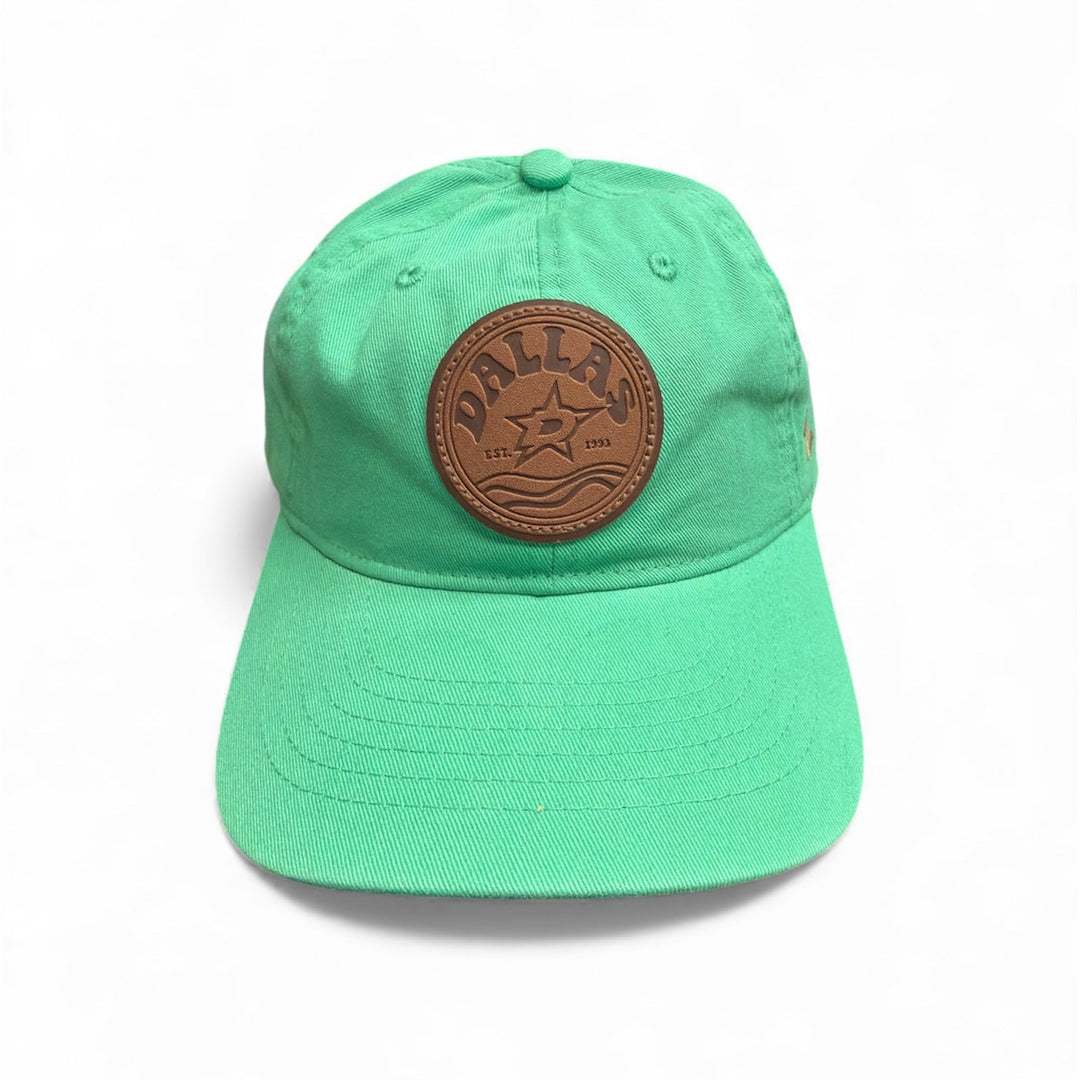 Green cap with a brown leather patch on a white background