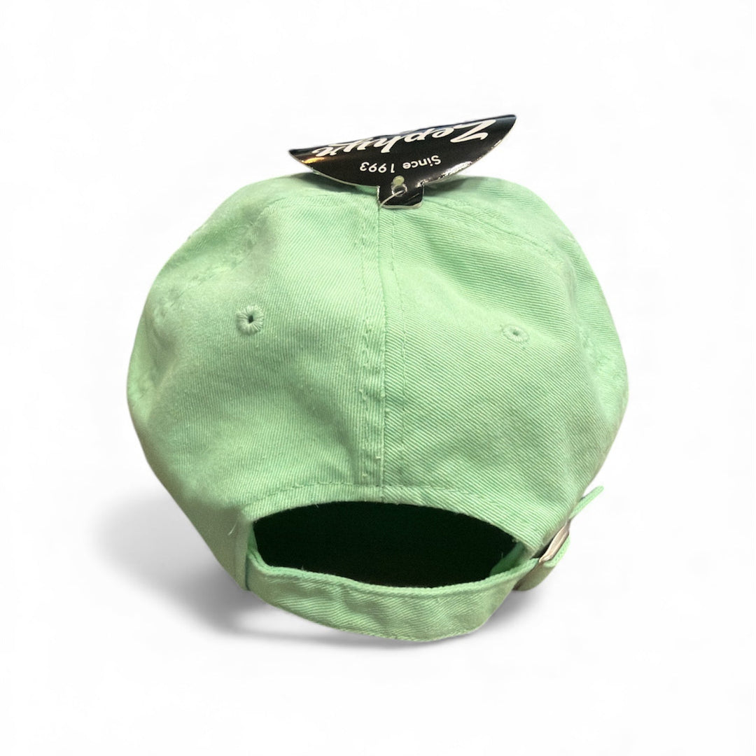 Light green cap with a brand tag on a white background