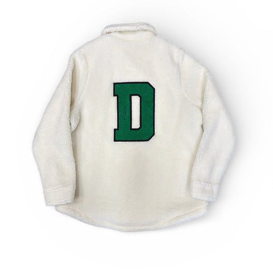 Cream jacket with a green letter 'D' on the back against a white background