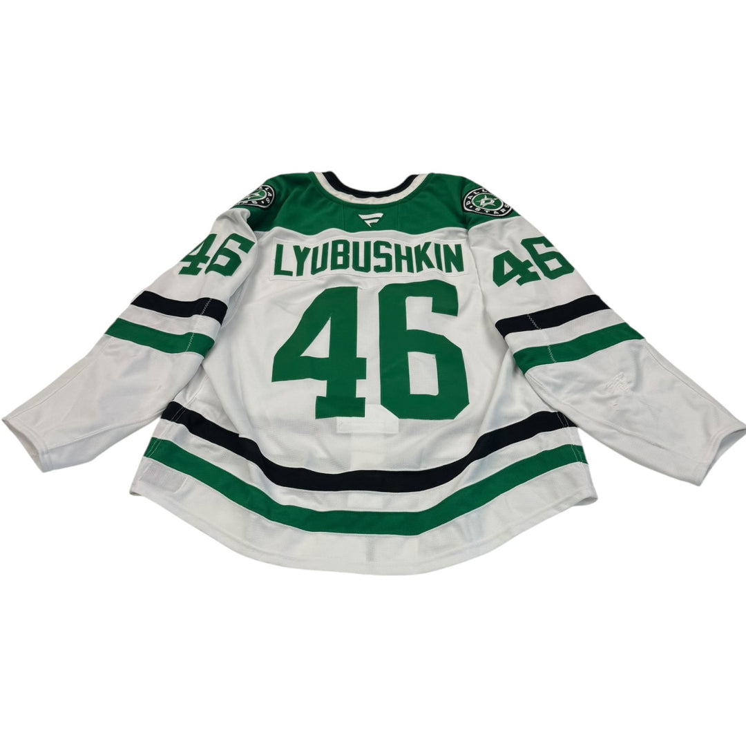 Game worn Dallas Stars jersey with number 46 and name 'Lyubushkin'. Jersey on a white background