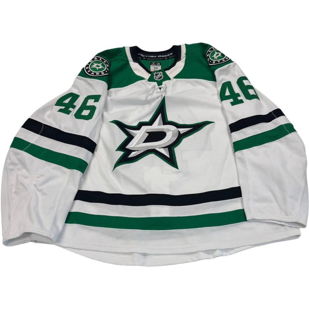 Game worn Dallas Stars Away jersey, number 46 on the sleeves with Dallas Stars logo on the chest. Hockey jersey on a white background
