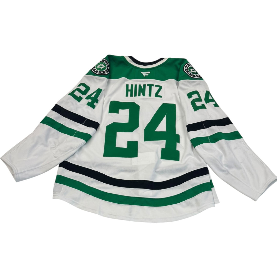 Game worn Dallas Stars away jersey with number 24 and name 'Hintz'  Jersey on a white background