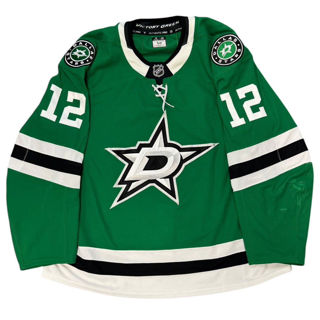 Game Worn Dallas Stars Home hockey jersey with number 12 on sleeves and Stars logo on chest with a white background