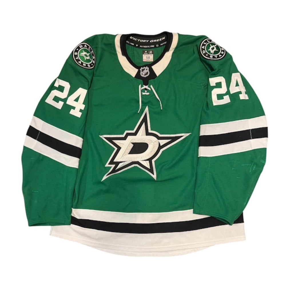 Game Worn Dallas Stars Away jersey with Stars logo on chest and number 24 on the sleeves. Jersey on a white background.