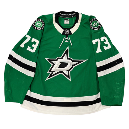 Game Worn Dallas Stars Home hockey jersey with number 73 on sleeves and Stars logo on chest with a white background