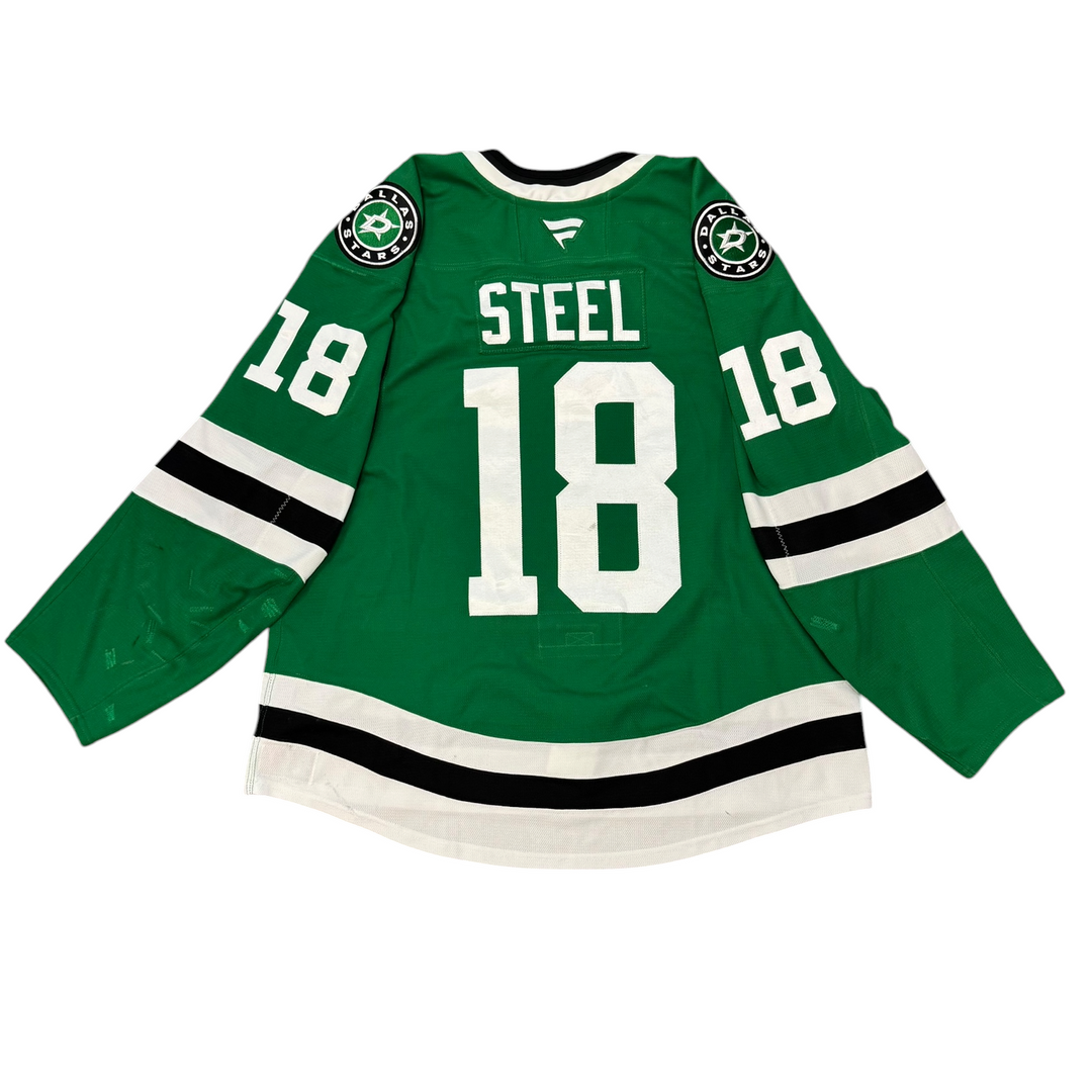Game Worn Dallas Star Home hockey jersey with 'Steel' and number '18' on a white background