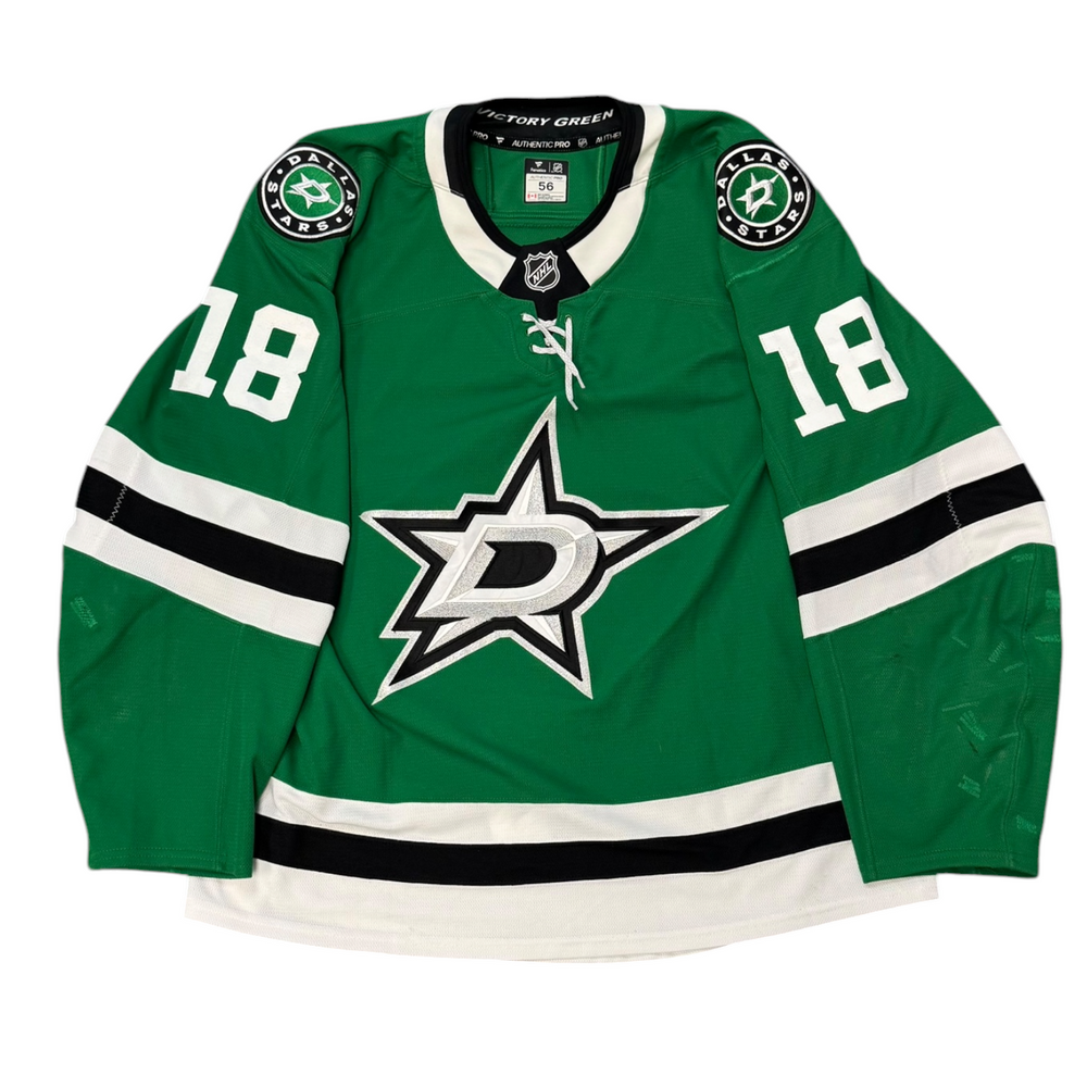 Game Worn Dallas Stars Home hockey jersey with number 18 on sleeves and Stars logo on chest with a white background