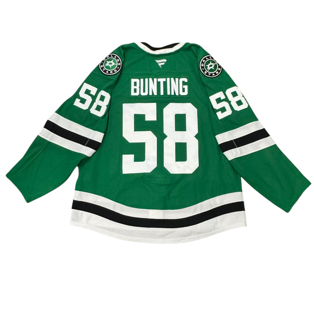 Game Worn Dallas Stars Home hockey jersey with number 58 on sleeves and Stars logo on chest with a white background