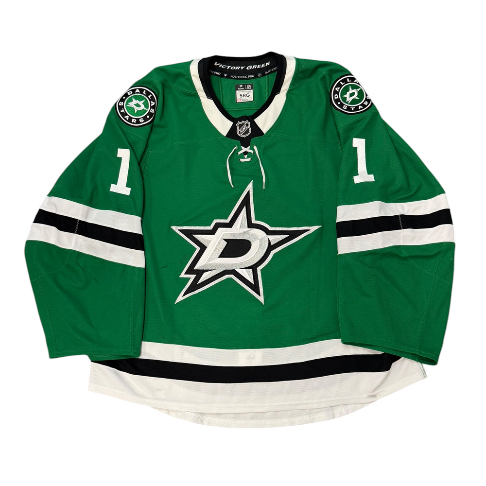 Game Worn Dallas Stars Home hockey jersey with number 1 on sleeves and Stars logo on chest with a white background