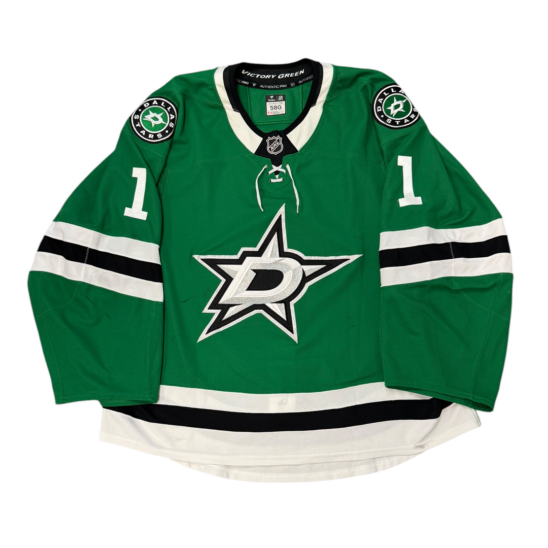 Game Worn Dallas Stars Home hockey jersey with number 1 on sleeves and Stars logo on chest with a white background
