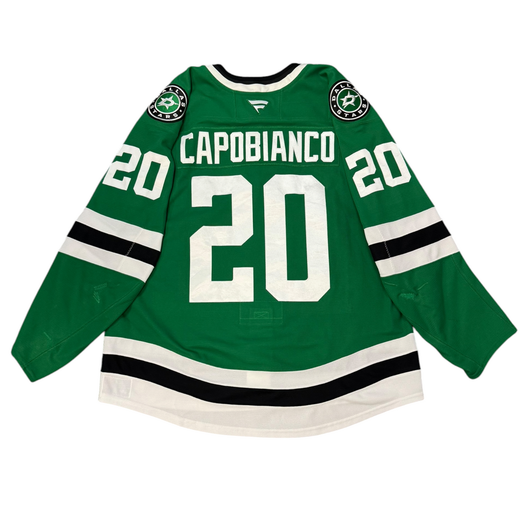 Game Worn Dallas Stars Home hockey jersey with number 20 and name 'Capobianco' on a white background