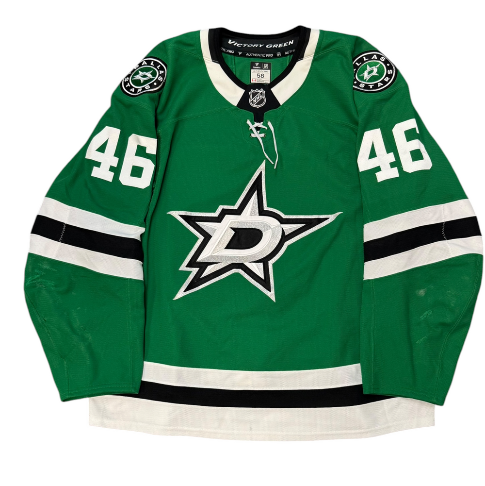 Game Worn Dallas Stars Home hockey jersey with number 46 on sleeves and Stars logo on chest with a white background