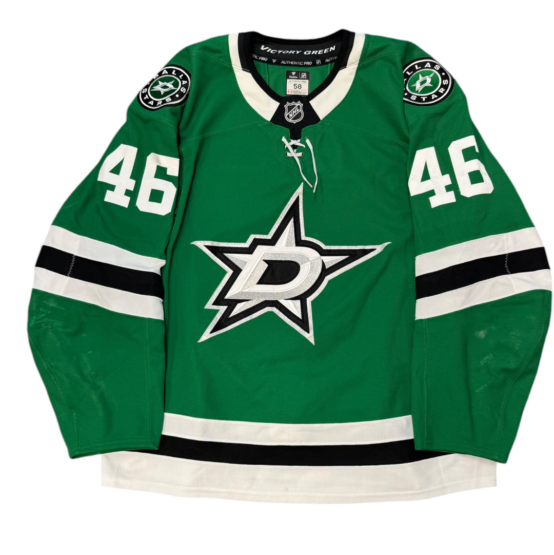 Game Worn Dallas Stars Home hockey jersey with number 46 on sleeves and Stars logo on chest with a white background