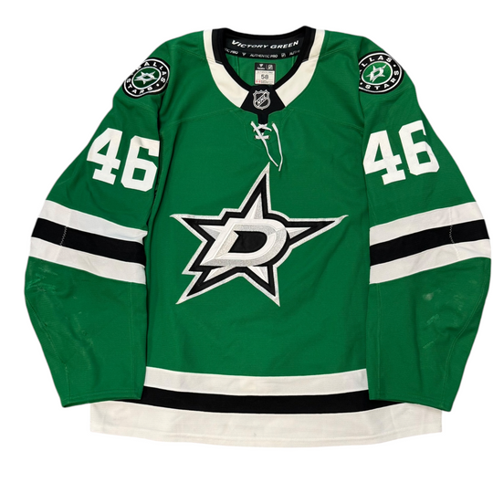 Game Worn Dallas Stars Home hockey jersey with number 46 on sleeves and Stars logo on chest with a white background