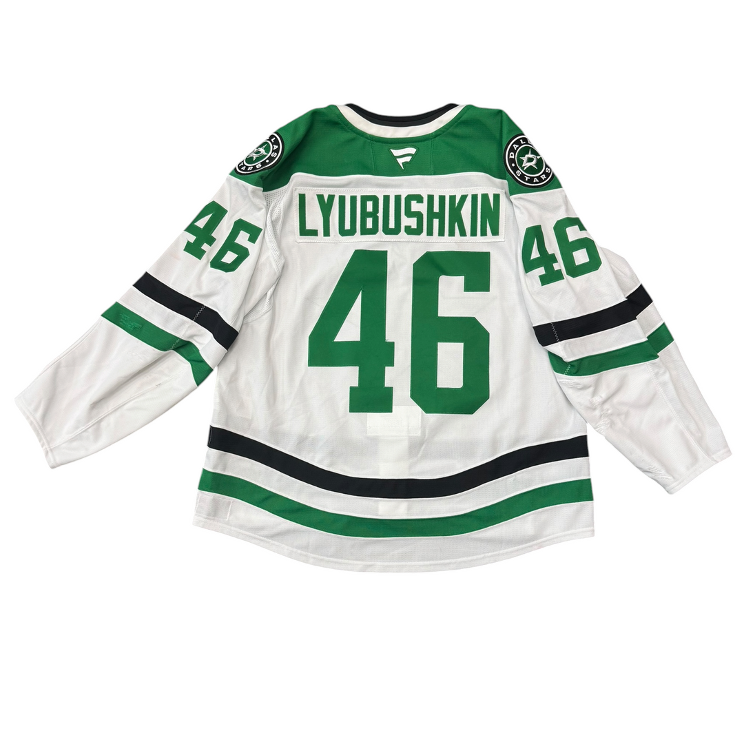 Game Worn Dallas Stars Away hockey jersey with number 46 and name 'Lyubushkin' on a white background