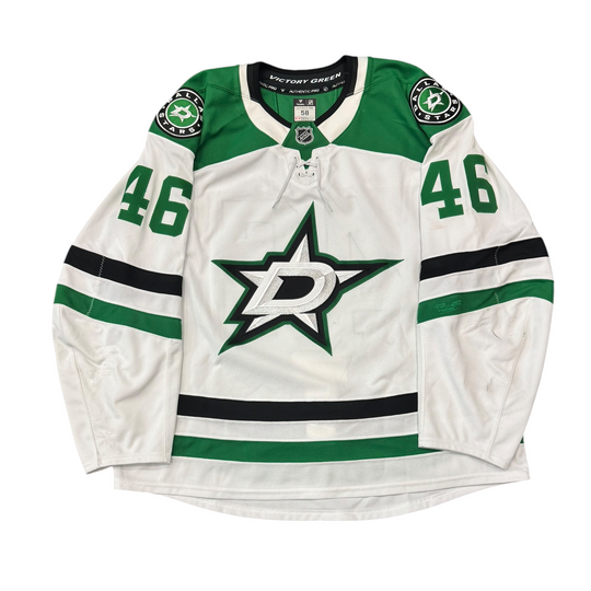 Game Worn Dallas Stars Away hockey jersey with number 46 on sleeves and Stars logo on chest with a white background