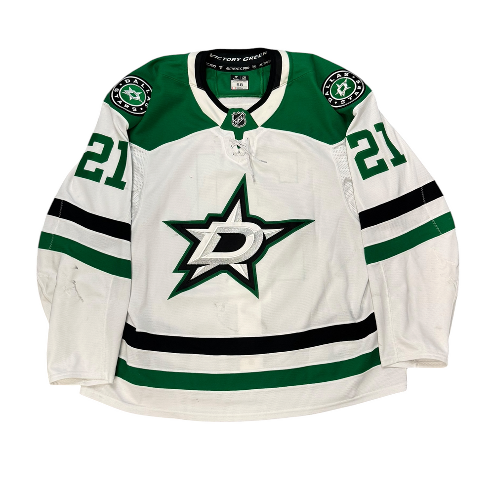 Game Worn Dallas Stars Away jersey with Stars logo on chest and number 21 on the sleeves. Jersey on a white background.