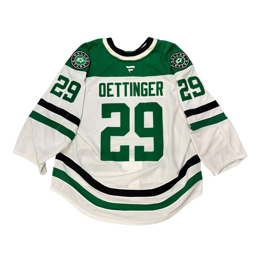Game worn Dallas Stars away jersey with number 29 and name 'Oettinger' on a white background