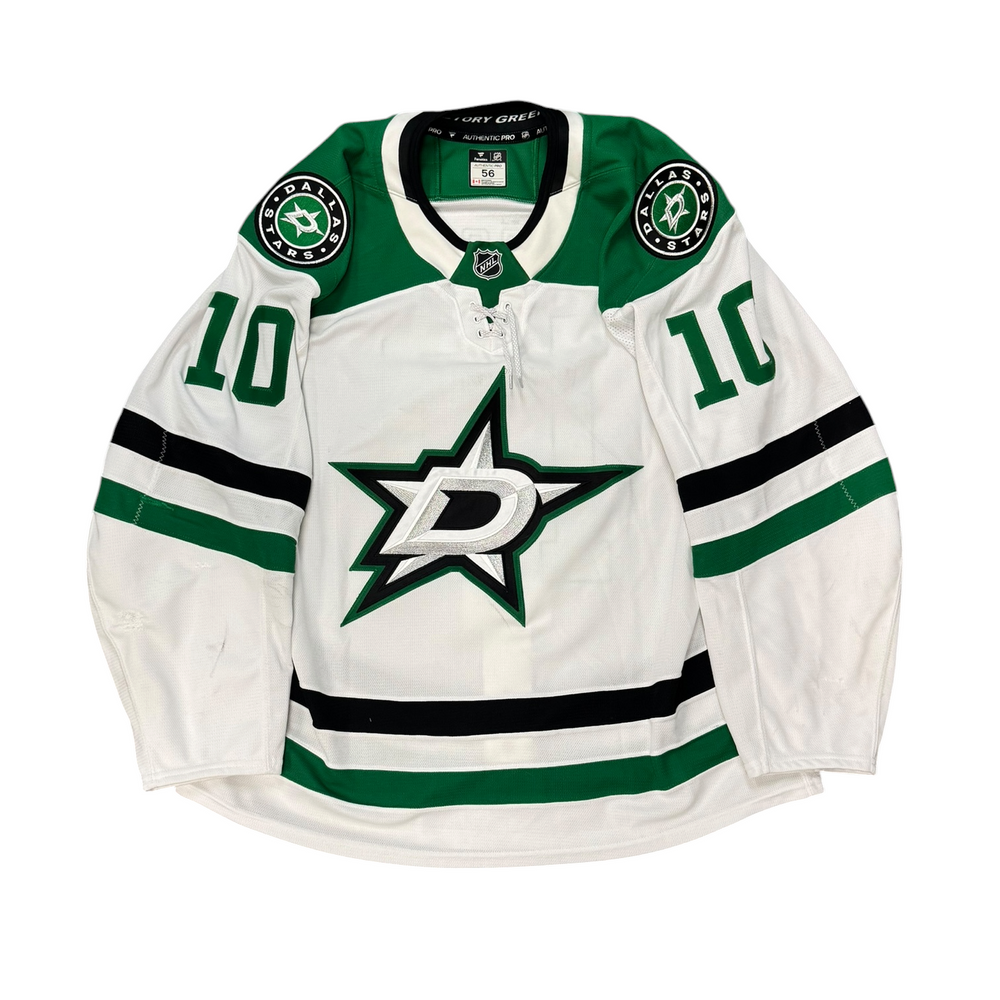 Game Worn Dallas Stars Away jersey with Stars logo on chest and number 10 on the sleeves. Jersey on a white background.