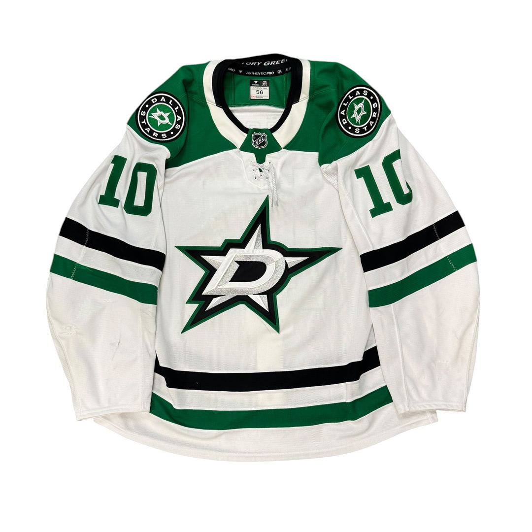 Game Worn Dallas Stars Away jersey with Stars logo on chest and number 10 on the sleeves. Jersey on a white background.